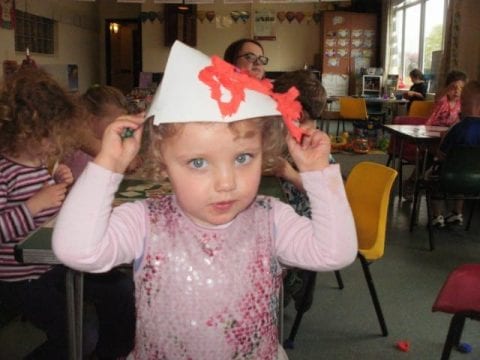 Woodcote Pre-School child with her Chinese hat!